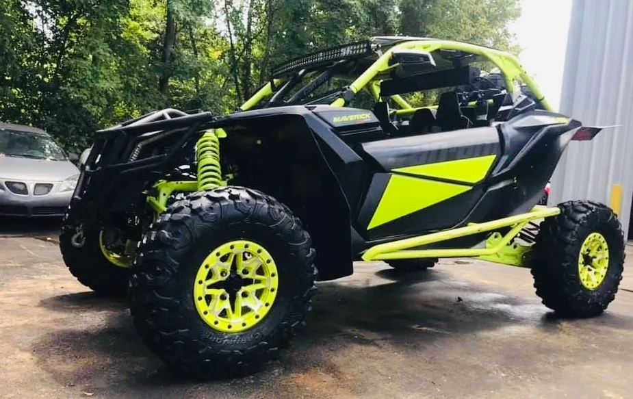 Black and green side-by-side UTV after professional detailing in Gastonia, North Carolina