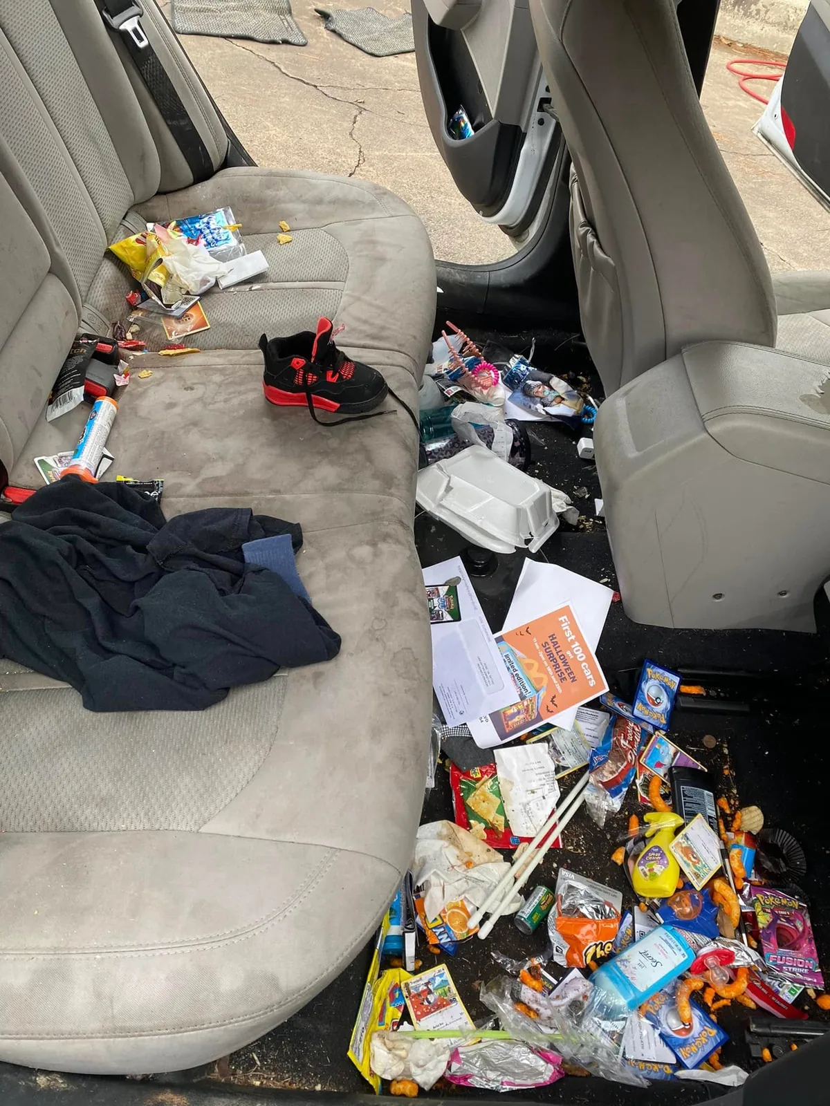 Severely soiled Hyundai Sonata rear interior before detailing at Firestone Auto Detail in Gastonia, NC