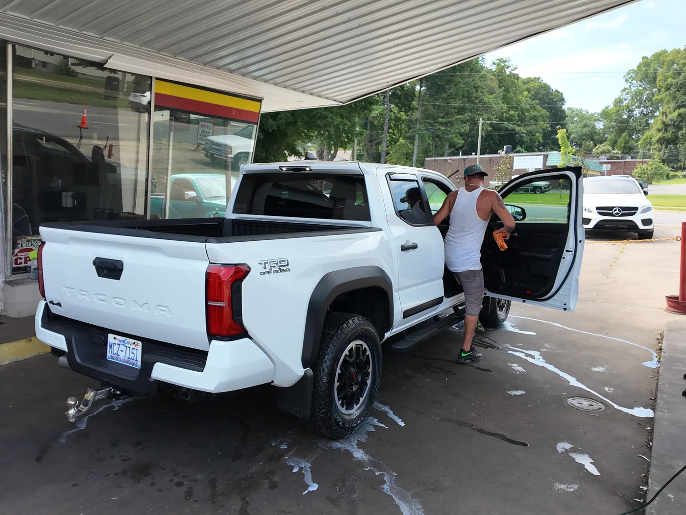 Donnie Ham evaluating and detailing a 2026 Toyota Tacoma at Firestone Auto Detail in Gastonia, North Carolina