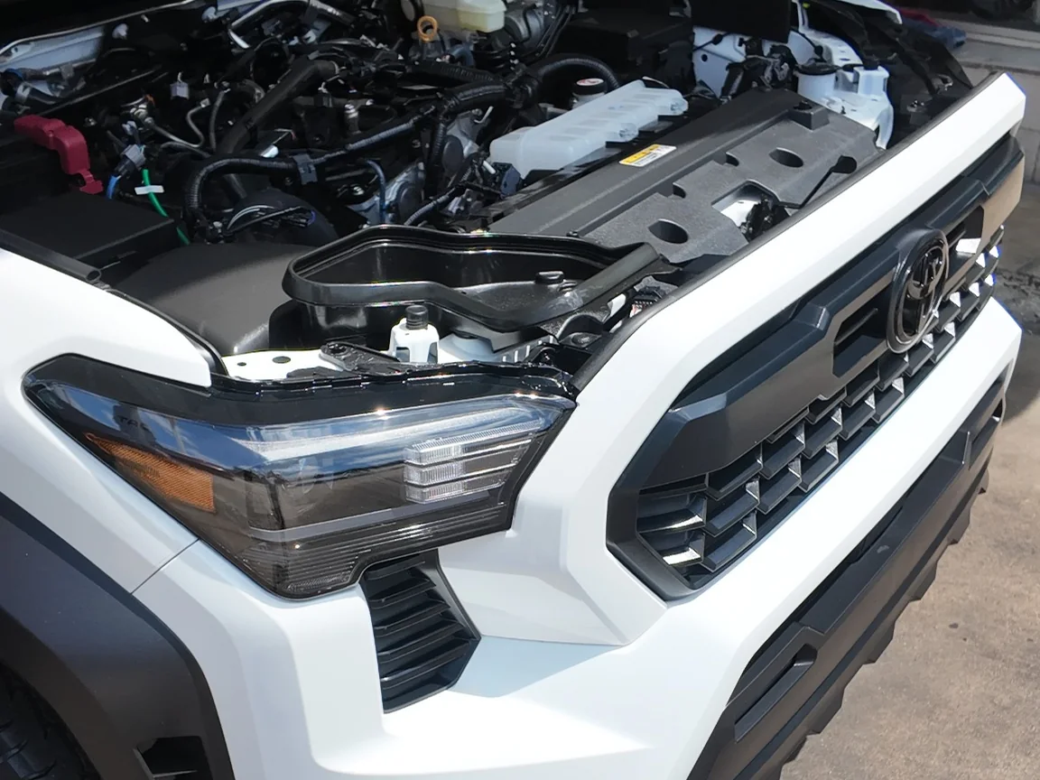 Clean engine bay on a 2026 Toyota Tacoma after detailing at Firestone Auto Detail